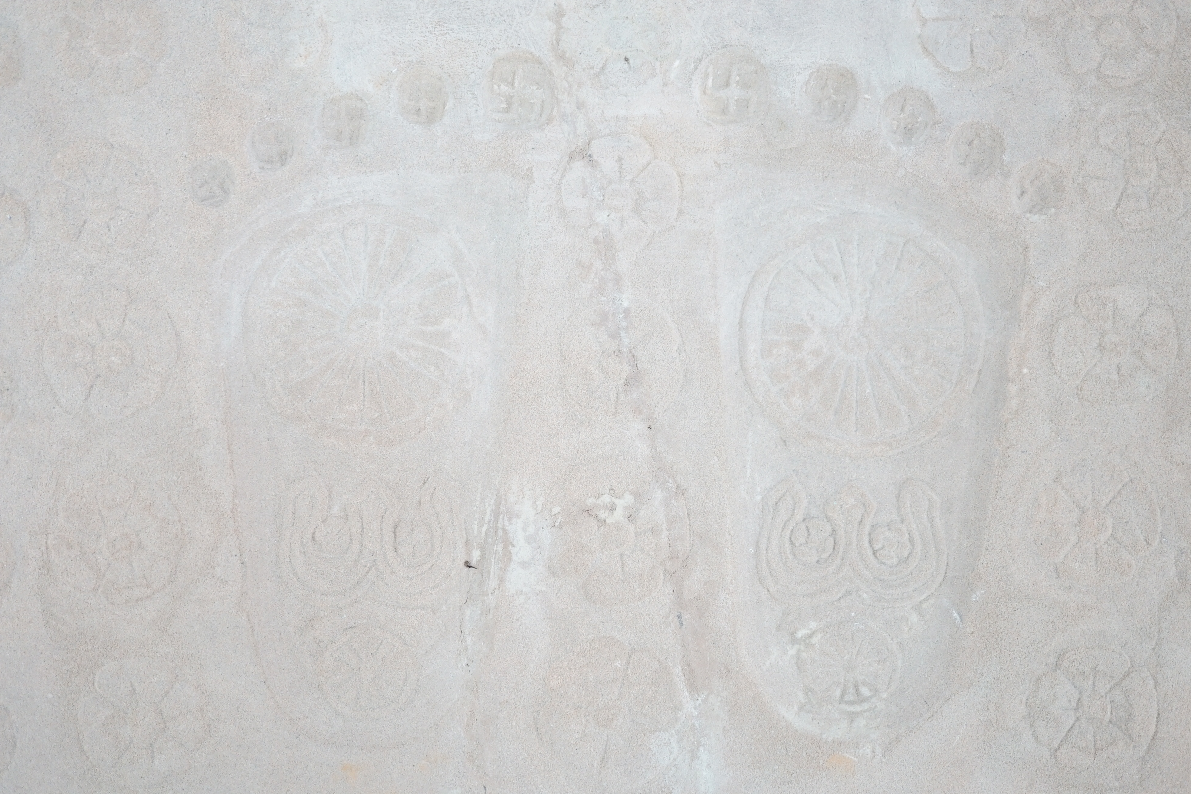 A sandstone relief of Buddha’s foot prints (Buddhapada), Southern India, 12th century